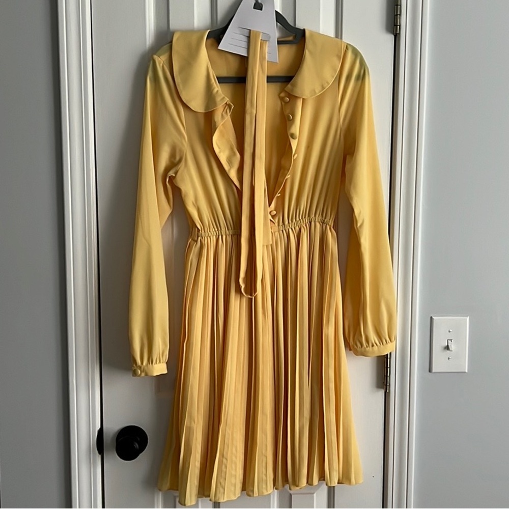 Yellow pleated dress